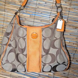 Traditional Coach pattern with orange Coach purse